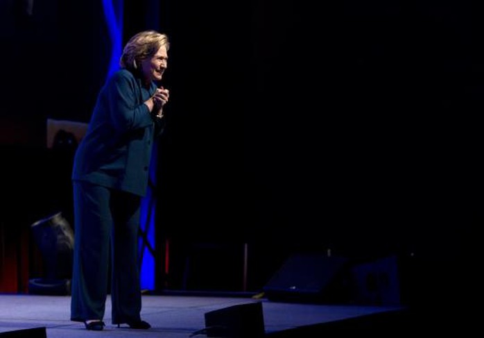 Former U.S. Secretary of State Hillary Clinton looks towards the audience, after someone threw an object onstage, during her speech to members of the Institute of Scrap Recycling Industries in Las Vegas, Nevada April 10, 2014. REUTERS-Las Vegas Sun-Steve Marcus