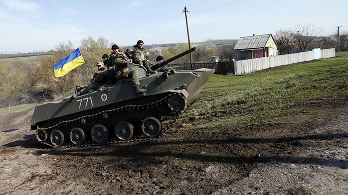 Ukrainian soldiers drive an airborne combat vehicle near Kramatorsk, in eastern Ukraine April 16, 2014. (Reuters / Marko Djurica)