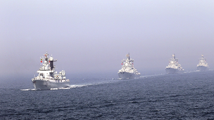 (FILE) Chinese missile destroyers navigate during the fleets review of the China-Russia joint naval exercise in the Yellow Sea April 26, 2012. (Reuters / China Daily)