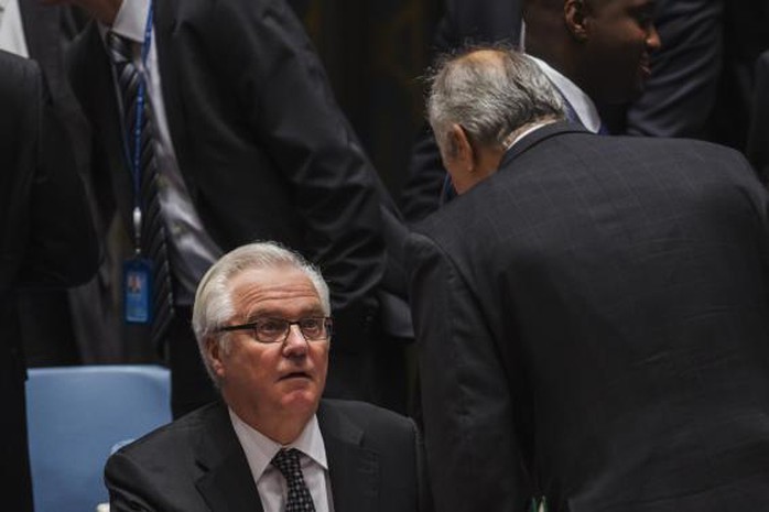 Syrias U.N. Ambassador Bashar Jaafari (R) speaks to Russias U.N. Ambassador Vitaly Churkin during a meeting of the United Nations Security Council at the U.N. headquarters in New York May 22, 2014. REUTERS-Lucas Jackson