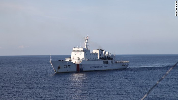 A Chinese Coast Guard vessel closely follows CG 8003.