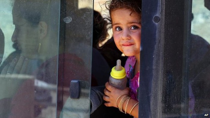 An Iraqi Christian girl, of those who fled from Mosul, Iraq and other nearby towns, arrives at a social club in Ainkawa in Irbil