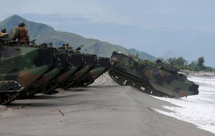 US military Amphibious Assault Vehicles assemble on a beach facing the South China Sea duringa joint exercise with the Philippines at San Antonio, north of Manila, on Monday.