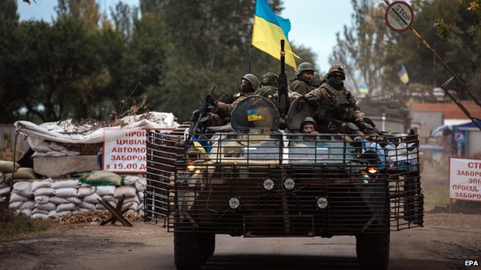 Ukrainian soldiers drive an Armoured Personnel Carrier (APC) in Kramatorsk town, Donetsk region, Ukraine, 11 September 2014