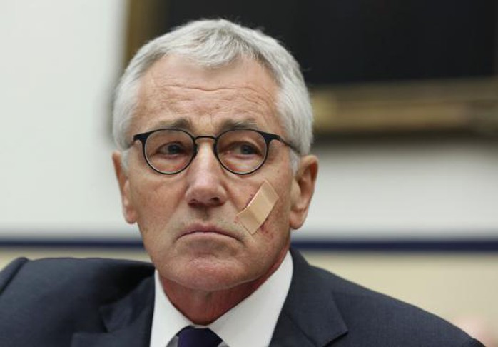 Secretary of Defense Chuck Hagel listens during his testimony at the House Armed Services Committee on Capitol Hill, November 13, 2014. REUTERS-Larry Downing