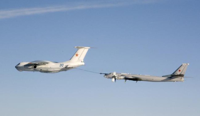 An undated handout photo provided by the Norwegian Army shows a Russian Tupolev Tu-95 strategic bomber refuelling from a Ilyushin IL-78 air-to-air refuelling tanker aircraft over an unknown location during a military exercise. . REUTERS-Norwegian NATO QRA Bodø-Handout