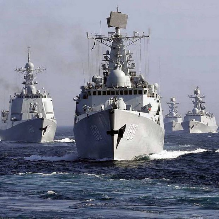 China is thought to be working to fit the ray gun on ships. Above: Chinese destroyer Wuhan leads a fleet of naval ships taking part in a joint exercise with Russia in the Sea of Japan (AP)