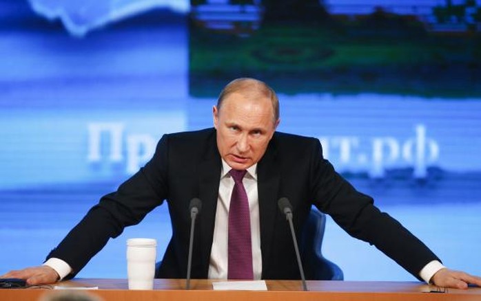 Russian President Vladimir Putin speaks during his annual end-of-year news conference in Moscow, December 18, 2014. REUTERS/Maxim Zmeyev