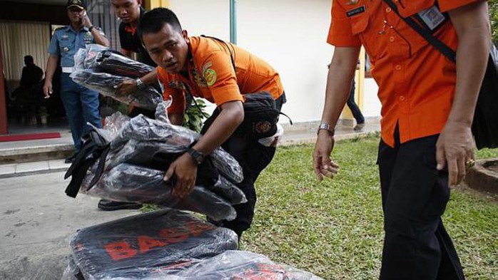 Search and rescue workers preparing to load body bags onto a flight to Kalimantan in Pangkal Pinang, Bangka on Dec 30, 2014. -- PHOTO: REUTERS 