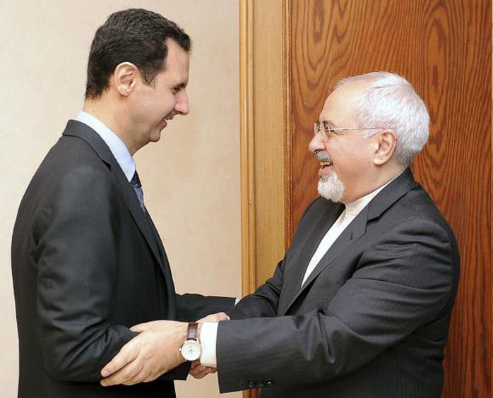 Tổng thống Syria Bashar al-Assad và Bộ trưởng Ngoại giao Mohammad Javad Zarif. Ảnh: Reuters