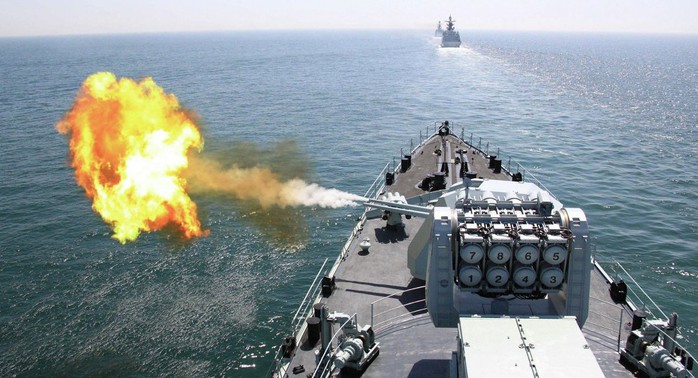 In this April 26, 2012 file photo released by China&apos;s Xinhua News Agency, Chinese navy&apos;s missile destroyer DDG-112 Harbin fires a shell during the China-Russia joint naval exercise in the Yellow Sea