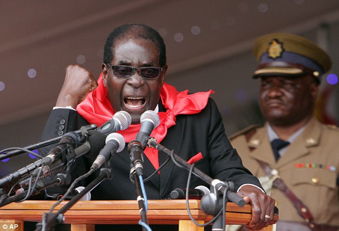 Leader: Preisdent of Zimbabwe Robert Mugabe, who is known for his brutal crusades against gay people, has mocked Americas decision to legalise gay marriage across all 50 states by proposing to Barack Obama