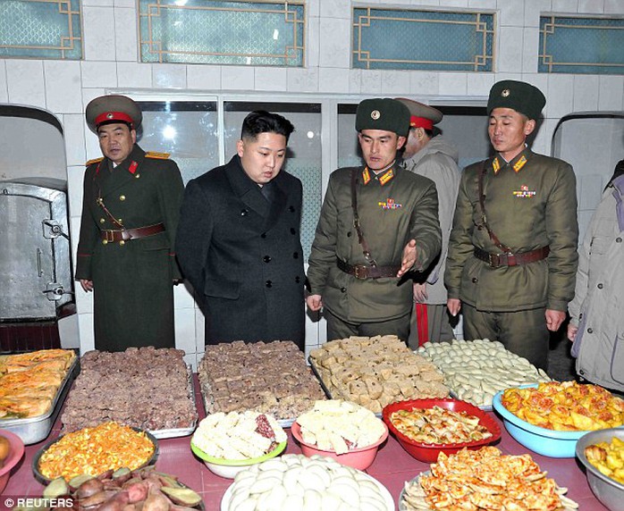 Food inspection: The leader was pictured concentrating intently on plates of food an army base in 2012