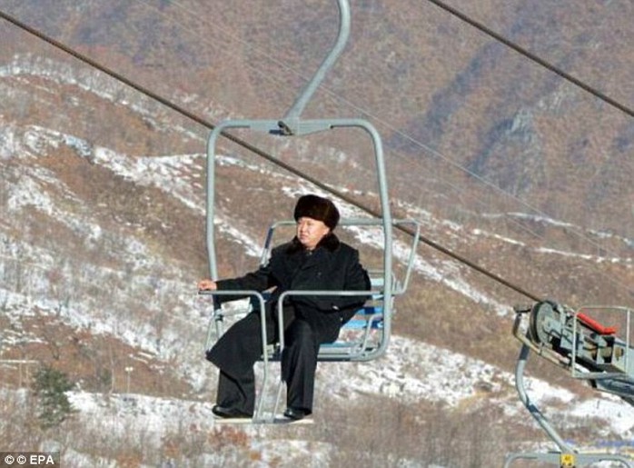 Lonely ride: Leader Kim takes a solitary ride on a chairlift at a purpose-built ski resort in 2013