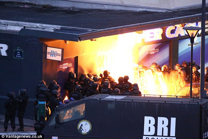 Going in: Special forces storm the Jewish grocery to the east of Paris where terrorist Amedey Coulibaly had taken at least seven people hostage