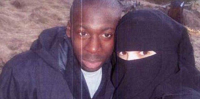 Jihadi couple: Boumeddiene (right)) walked away from a low-paid job as a cashier  in 2009 and started wearing a veil. She ‘devoted herself’ to Coulibaly (left)