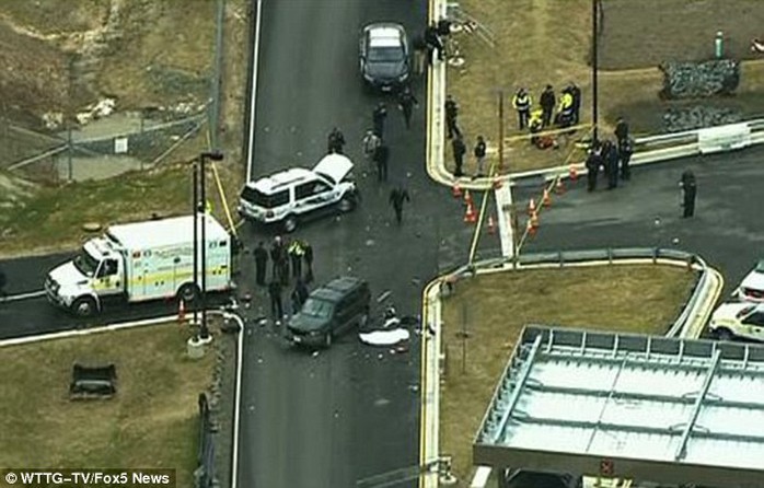 Aerial footage shows what appears to be a body covered by a sheet and two crashed SUVs outside the gates of Fort Meade, home to the NSA and the US militarys Cyber Command