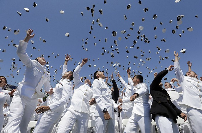 Success! Graduating members of the U.S. Naval Academy throws their covers in the air at the end of the Academys graduation