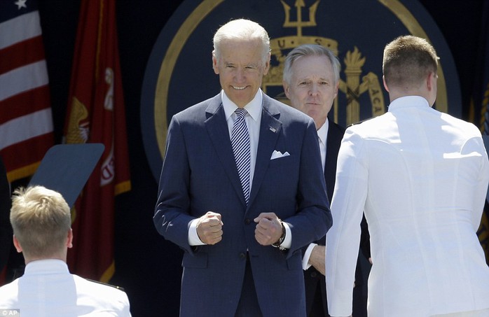 Excitement: Biden, who is pictured gesturing as graduating members head towards him on the stage, told the crowd that many of them will be stationed in the Asia-Pacific region to keep the peace