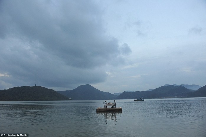 From the illuminated wooden dock, the couple can take in the breathtaking views of the area, much of which is covered in lush forest