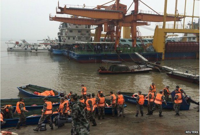 Rescue workers are seen near the site where a ship sank, in the Jianli section of the Yangtze River, Hubei province, China, 2 June 2015