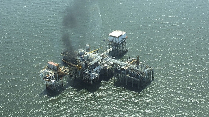 U.S. Coast Guard aerial photo shows a fire on board an oil production platform in Breton Sound Block 21 located about 20 miles (32 km) east of the boot tip of Louisiana, in the Gulf of Mexico May 22, 2015. (Reuters/Liam Mcdonnell)