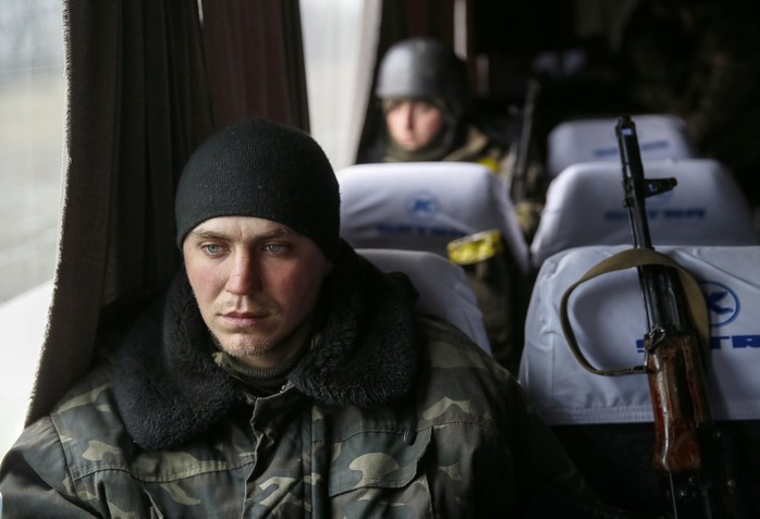 Ukrainian servicemen who fought in Debaltseve are seen in a bus before leaving for home, near Artemivsk