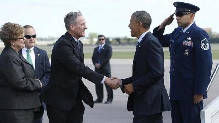 US President Barack Obama (second from right) is greeted by South Dakota Governor Dennis Daugaard (second from left) and his wife Linda Daugaard (left) as he arrives aboard Air Force One at Watertown Regional Airport in Watertown, South Dakota, on May 8, 2015. -- PHOTO: REUTERS 