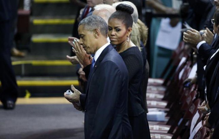 Nhà lãnh đạo Mỹ tới cùng phu nhân Michelle Obama. Ảnh: Reuters