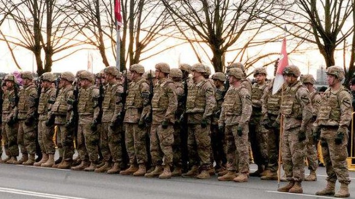 US soldiers await the order to march in the Latvia Day Parade on Nov. 18 in Riga, Latvia.