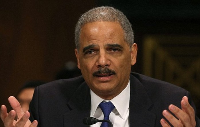 The men conspired to gather economic intelligence on behalf of Russia, including alleged information about U.S. sanctions against the country, and to recruit New York City residents as intelligence sources, U.S. Attorney General Eric Holder (pictured in a file photo) said in a statement