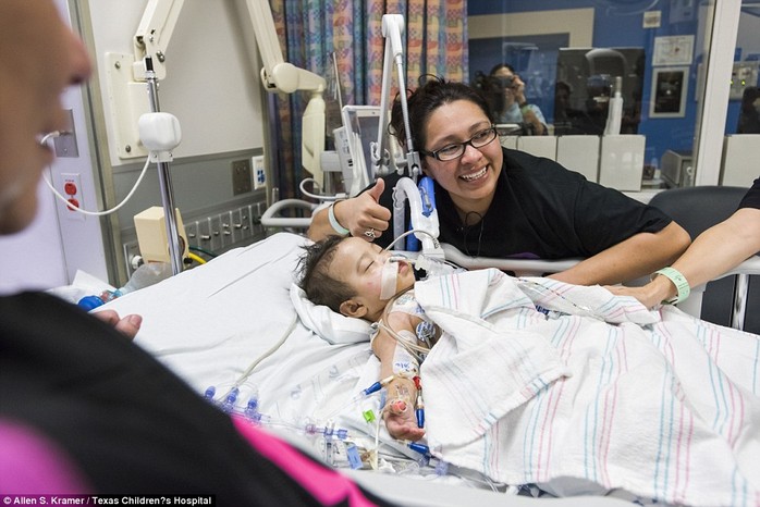 Mother Elysse Mata goes to see one of her daughters in recovery and gives the thumbs up after her conjoined twins were successfully separated