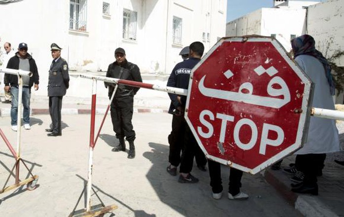 People are pictured near the morgue in Tunis March 19, 2015. REUTERS/Zoubeir Souissi