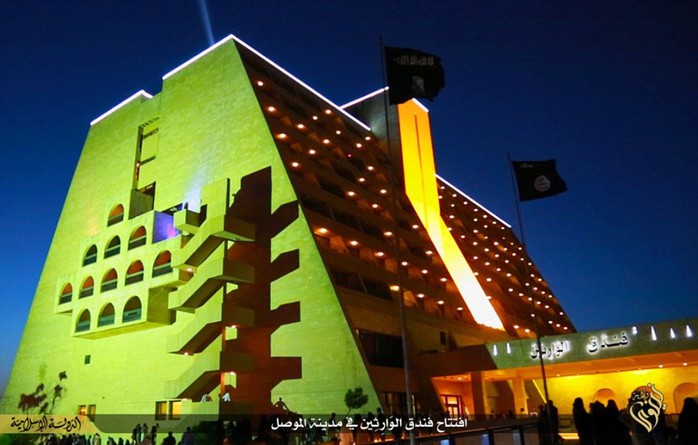 All lit up: The once-renowned, five-star Ninawa International Hotel is located in the extremists northern Iraqi stronghold, Mosul