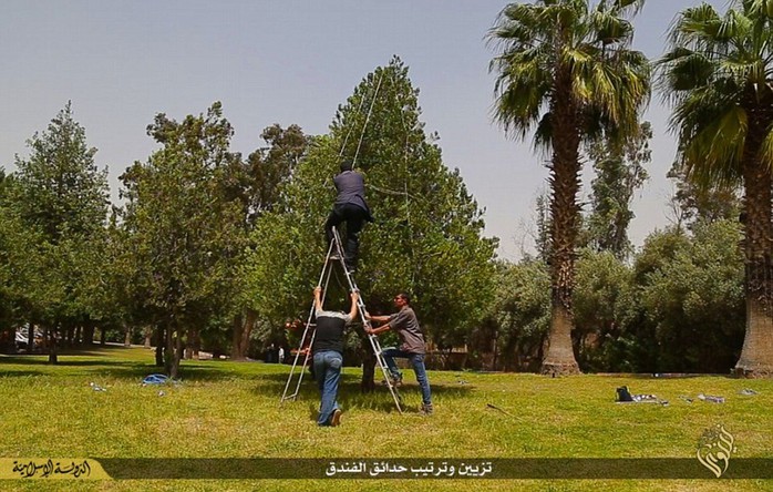 Pure propaganda: The once-renowned Ninawa International Hotel in extremist stronghold Mosul is seen being prepared for use by ISIS