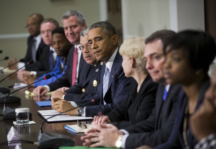 President Barack Obama, center, during his meeting with elected officials, law enforcement officials and community and faith leaders in the Old Executive Office Building on the White House Complex in Washington, Monday, Dec. 1, 2014. Obama says that in the wake of the shooting of an unarmed 18-year-old man in Ferguson, Missouri, he wants to make sure to build better trust between police and the communities they serve.(AP Photo/Pablo Martinez Monsivais)