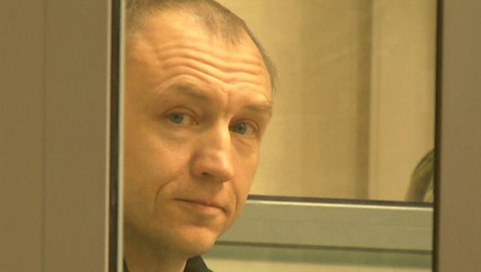 A still image from a video footage shows Estonian police officer Eston Kohver in a defendants cage during a court hearing in Pskov, Russia, June 2, 2015. REUTERS/Reuters TV
