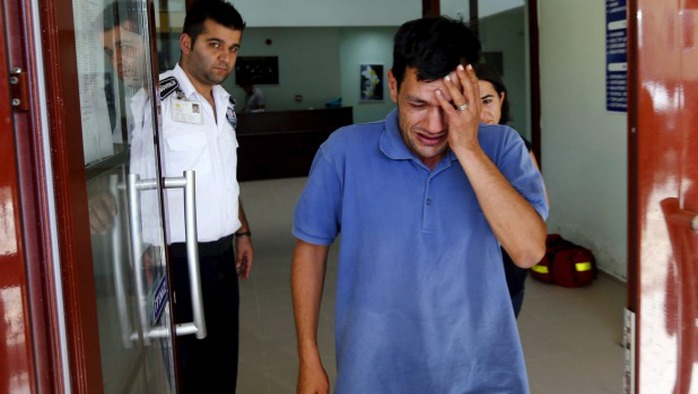 Abdullah Kurdi, father of three-year old Aylan Kurdi who was found washed up on a Turkish beach, cries as he leaves a morgue in Mugla, Turkey.