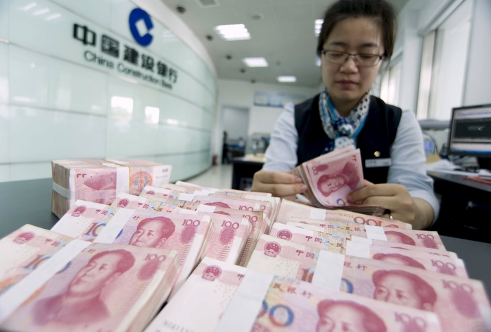 Trung Quốc bất ngờ phá giá đồng nhân dân tệ hôm 11-8Ảnh: Reuters
