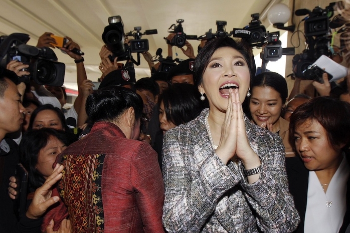 Bà Yingluck Shinawatra rời khỏi trụ sở NLA hôm 22-1 Ảnh: REUTERS