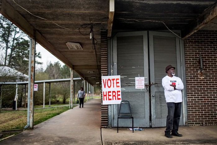 James Spraggins volunteered outside the polling station at the Muscoda Community Center in Muscoda, Ala.