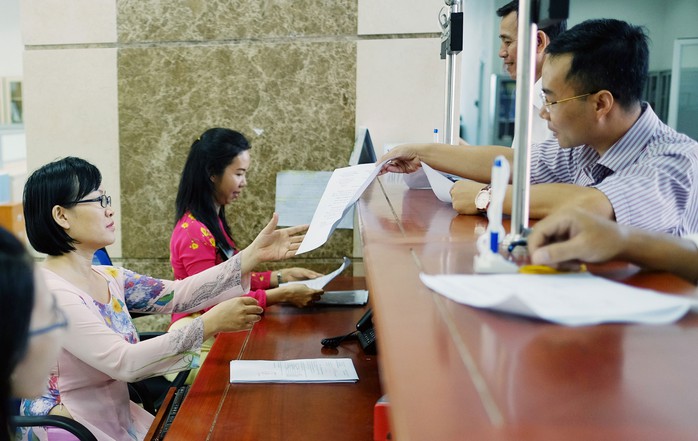 Thủ tướng Nguyễn Xuân Phúc yêu cầu Bộ Tài chính phải có trách nhiệm với từng đồng thuế của dân. Trong ảnh: Làm thủ tục thuế ở Cục Thuế TP HCM Ảnh: HOÀNG TRIỀU