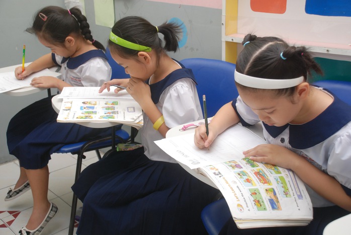 
Học sinh đang học tiếng Trung tại một trường tiểu học tại TP HCM Ảnh: TẤN THẠNH
