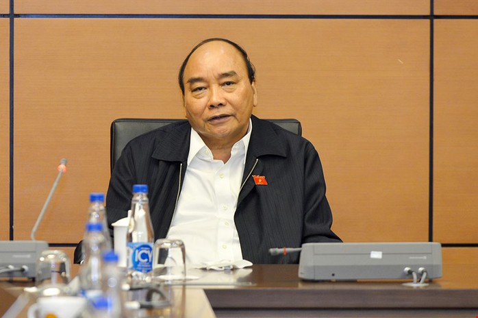Chủ tịch nước Nguyễn Xuân Phúc: Tấm lòng, công trạng của người dân, doanh nghiệp là vô cùng lớn - Ảnh 1.