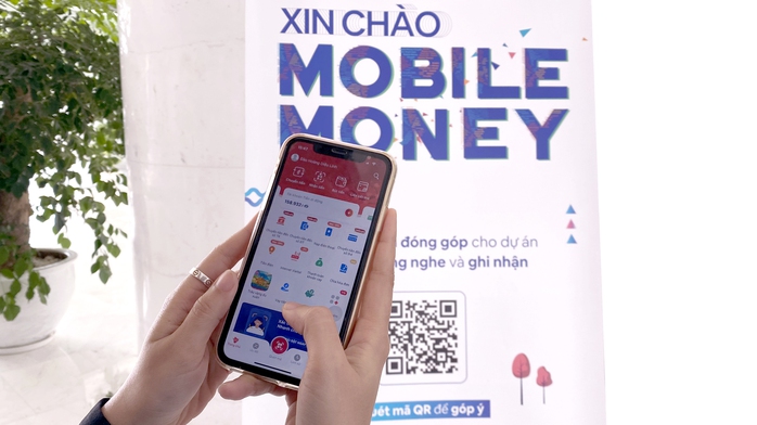 Mobile Money hiện thực giấc mơ mua mớ rau, con cá, đi trà đá...  bằng di động - Ảnh 1.