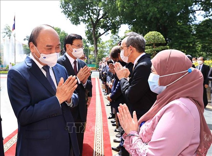 Chủ tịch nước chủ trì lễ đón Tổng Bí thư, Chủ tịch nước Lào - Ảnh 6.