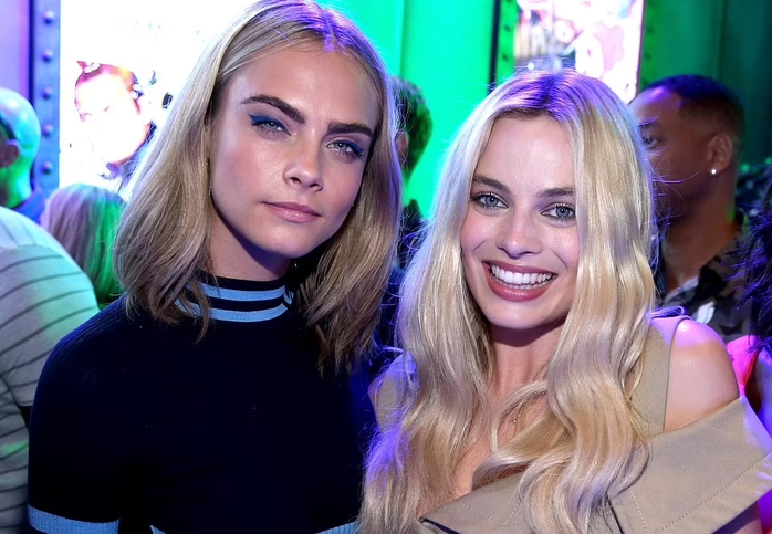 Chụp lén hai siêu mẫu Margot Robbie và Cara Delevingne, tay săn ảnh bị đánh gãy tay - Ảnh 1.