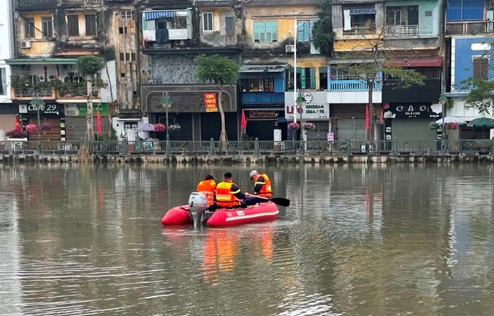 Nghi vấn đôi nam nữ nhảy xuống sông tự tử ngày mùng 2 Tết - Ảnh 1.