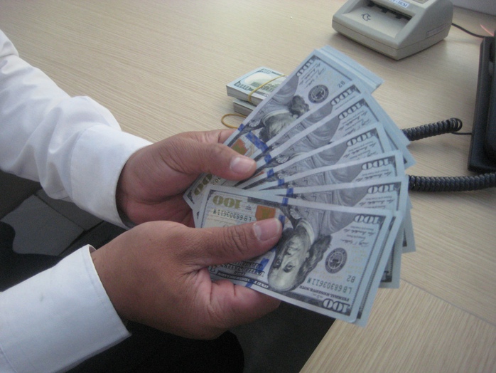 Ngân hàng Nhà nước bán USD, tỉ giá VNĐ/USD hạ nhiệt- Ảnh 1. Ngân hàng Nhà nước bán USD, tỉ giá VNĐ/USD hạ nhiệt- Ảnh 1.