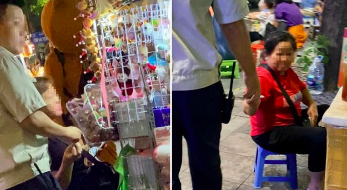 Hai nhân viên "làm luật" với người bán hàng rong ở hồ Gươm- Ảnh 1. Hai nhân viên "làm luật" với người bán hàng rong ở hồ Gươm- Ảnh 1.